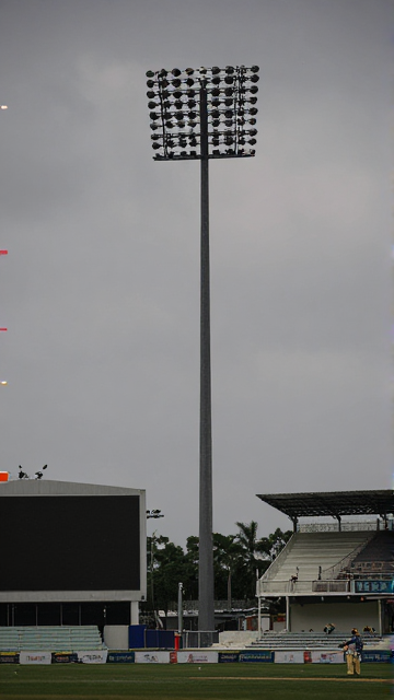 Floodlight mast at a cricket stadium in daylight